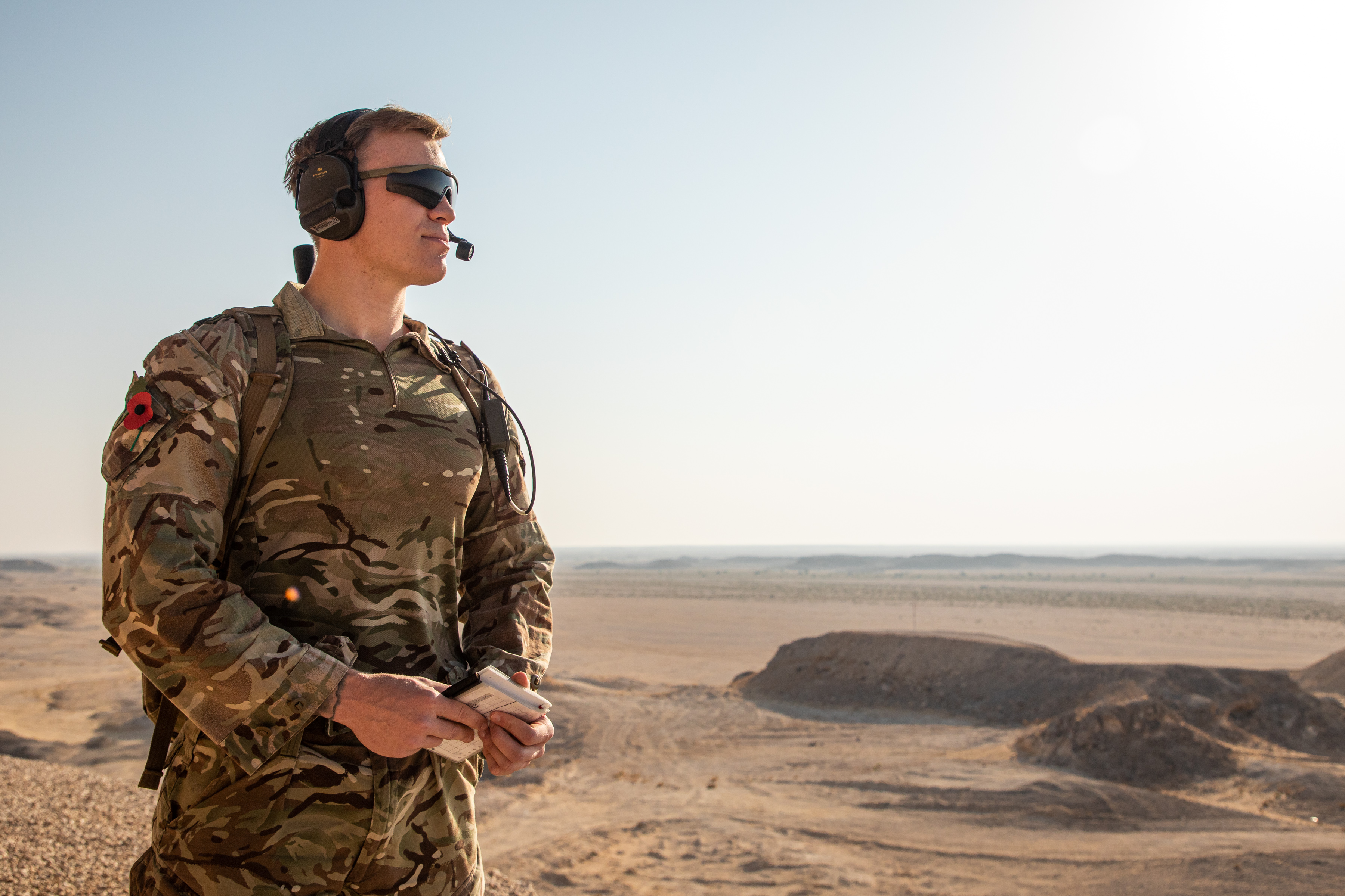 Personnel outside in Oman with head equipment on.